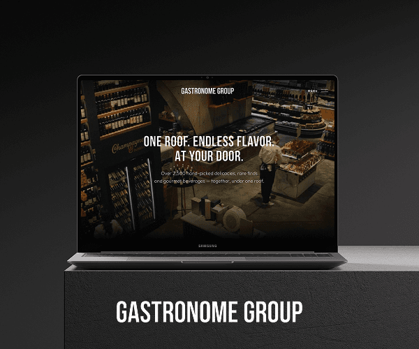 Gastronome Group website on a laptop